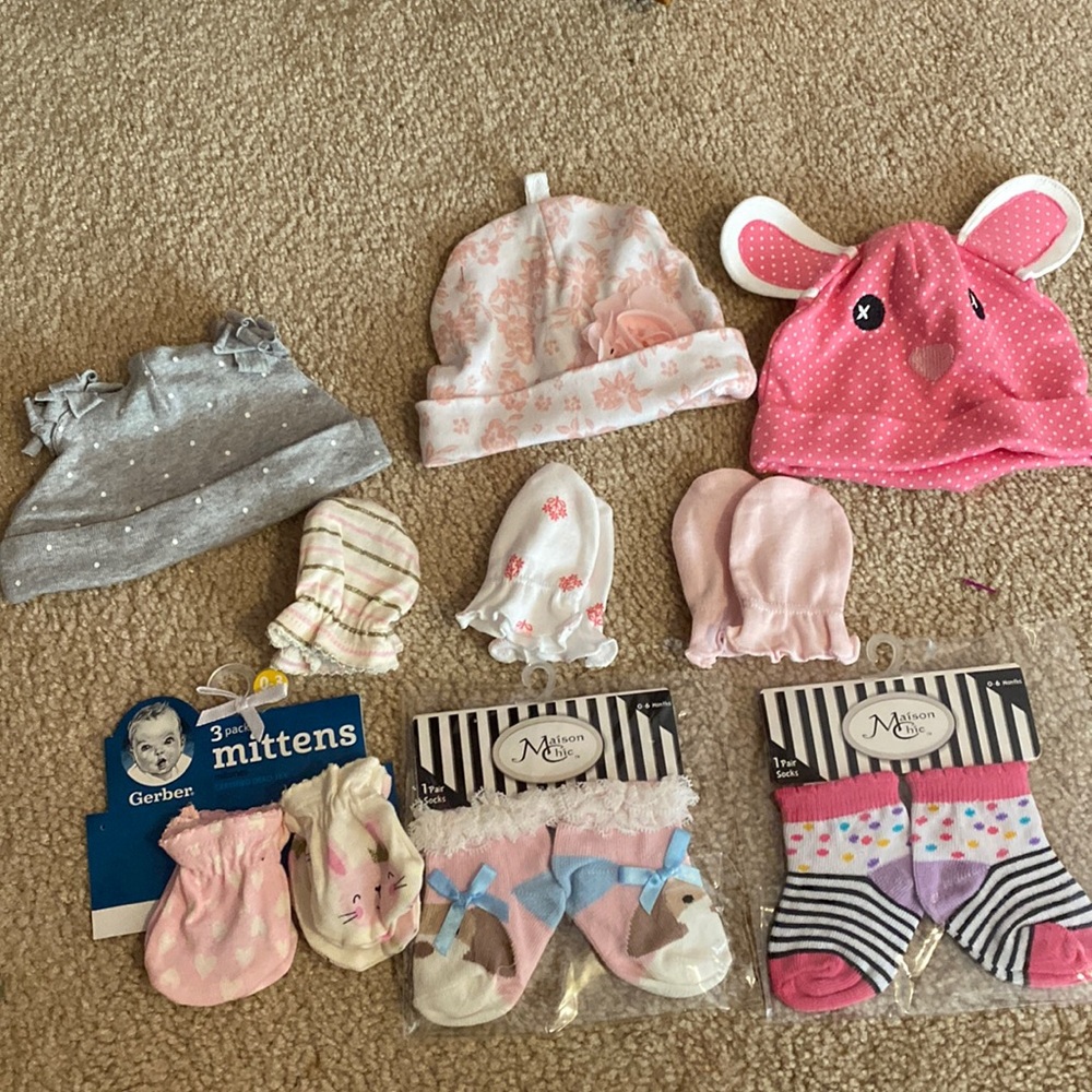 Assorted baby hats, mittens and socks.
